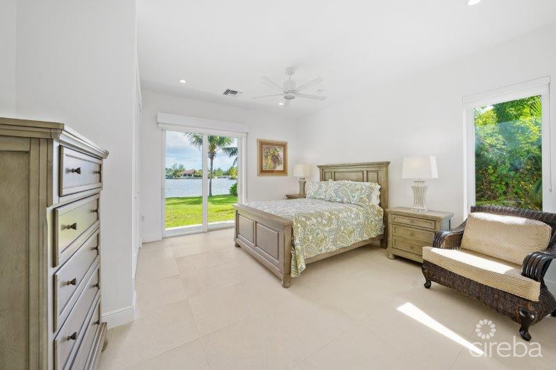 UNIQUE PATRICK’S ISLAND CANAL FRONT HOME W GUEST HOUSE AND 3 CAR GARAGE – SOON TO BE GATED!