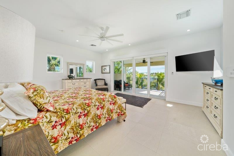 UNIQUE PATRICK’S ISLAND CANAL FRONT HOME W GUEST HOUSE AND 3 CAR GARAGE – SOON TO BE GATED!