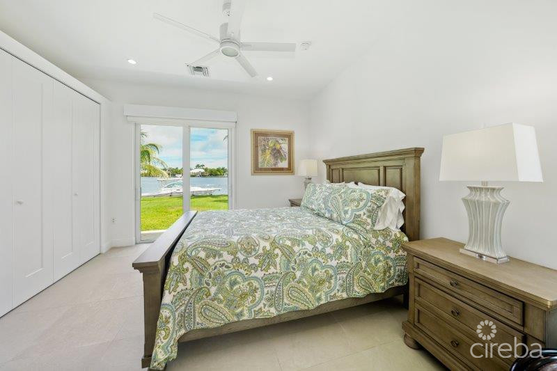 UNIQUE PATRICK’S ISLAND CANAL FRONT HOME W GUEST HOUSE AND 3 CAR GARAGE – SOON TO BE GATED!
