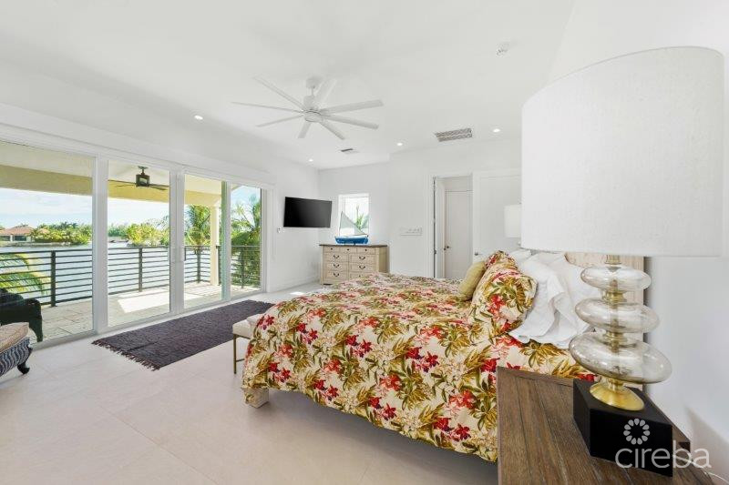 UNIQUE PATRICK’S ISLAND CANAL FRONT HOME W GUEST HOUSE AND 3 CAR GARAGE – SOON TO BE GATED!