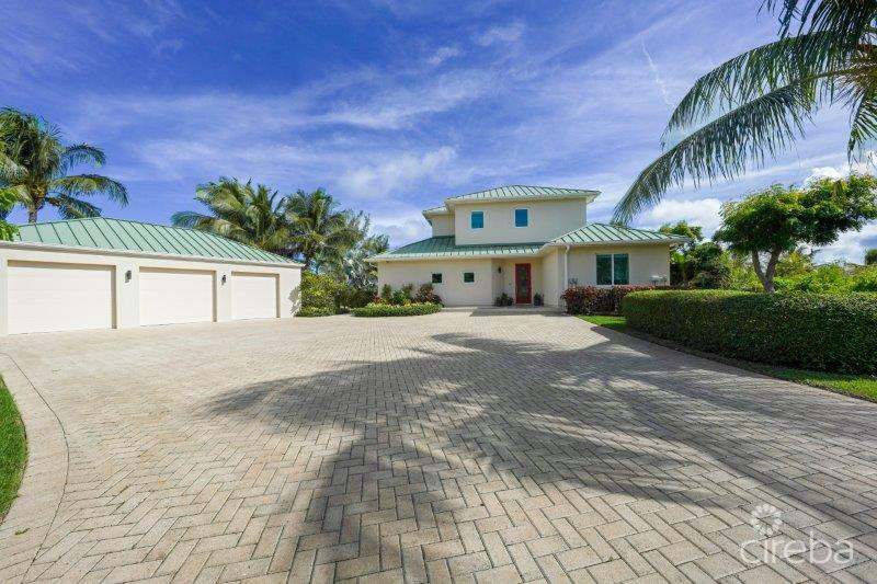 UNIQUE PATRICK’S ISLAND CANAL FRONT HOME W GUEST HOUSE AND 3 CAR GARAGE – SOON TO BE GATED!