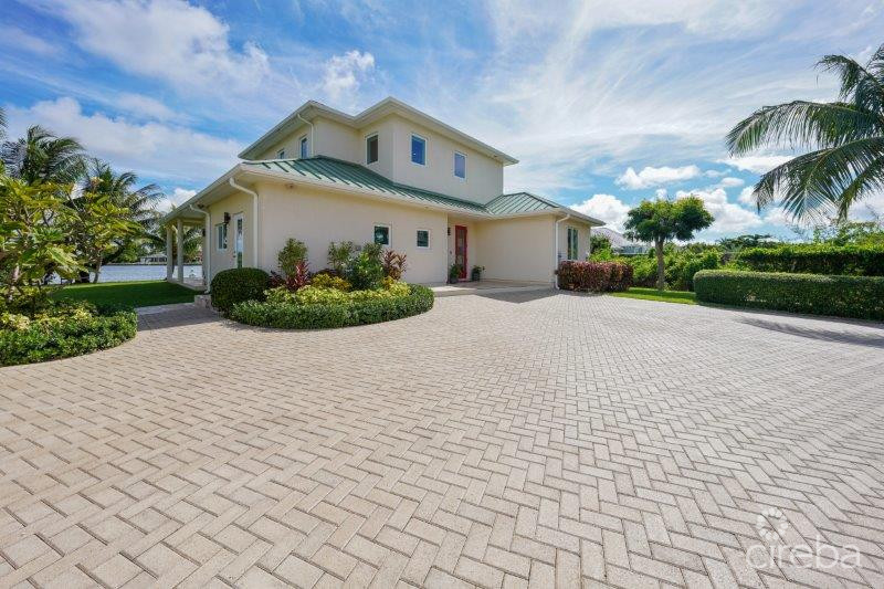 UNIQUE PATRICK’S ISLAND CANAL FRONT HOME W GUEST HOUSE AND 3 CAR GARAGE – SOON TO BE GATED!