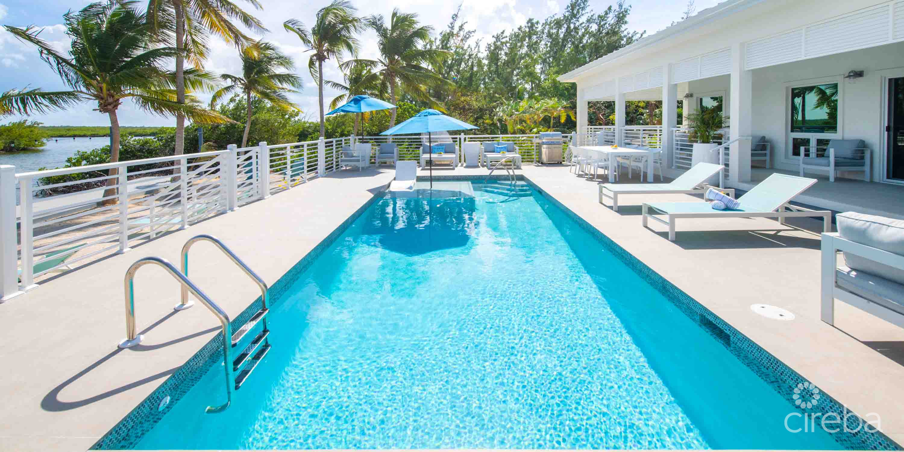 CARIB SUN – EXQUISITE WATERFRONT ESTATE W /GUESTHOUSE IN CAYMAN KAI