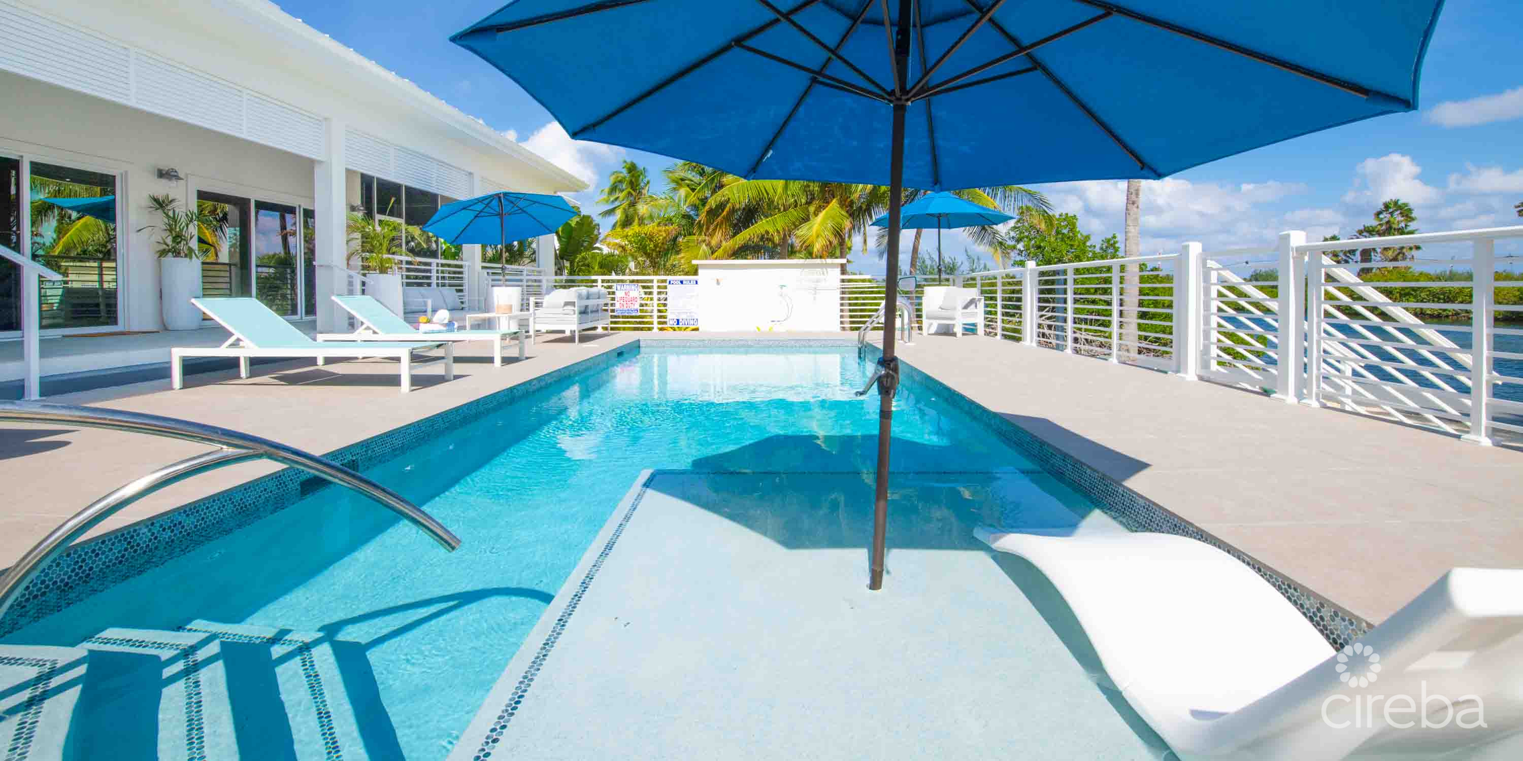 CARIB SUN – EXQUISITE WATERFRONT ESTATE W /GUESTHOUSE IN CAYMAN KAI