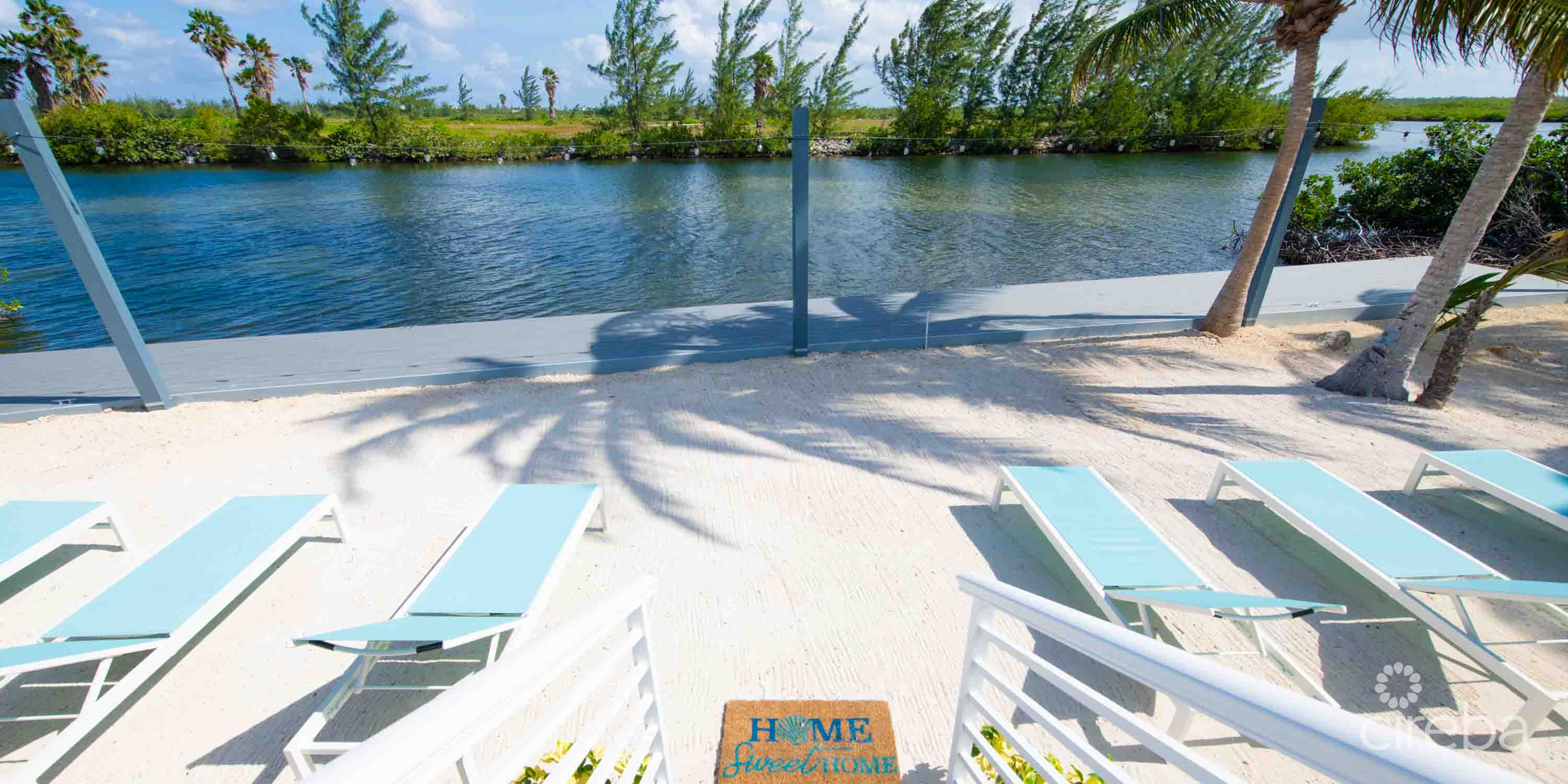 CARIB SUN – EXQUISITE WATERFRONT ESTATE W /GUESTHOUSE IN CAYMAN KAI