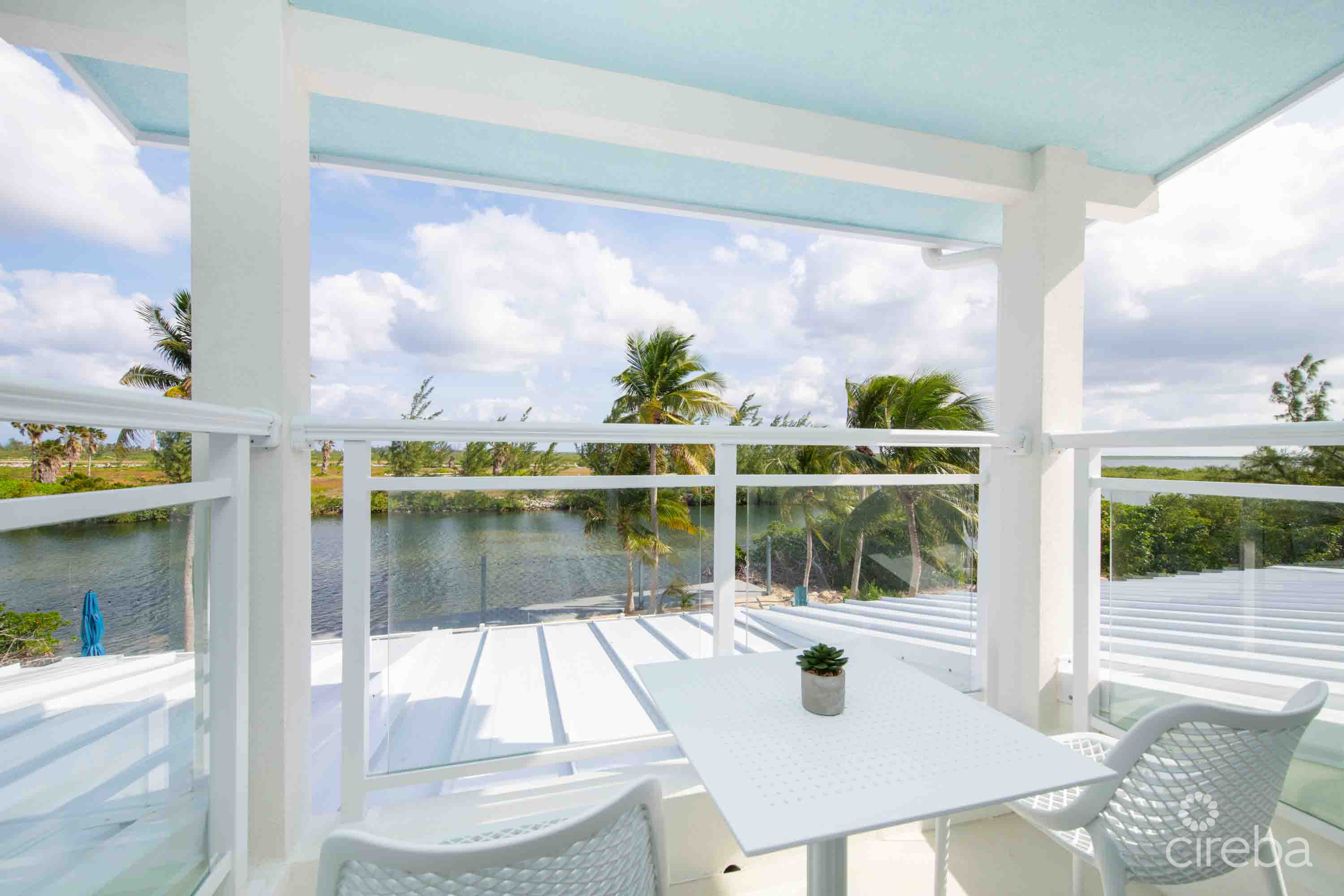 CARIB SUN – EXQUISITE WATERFRONT ESTATE W /GUESTHOUSE IN CAYMAN KAI