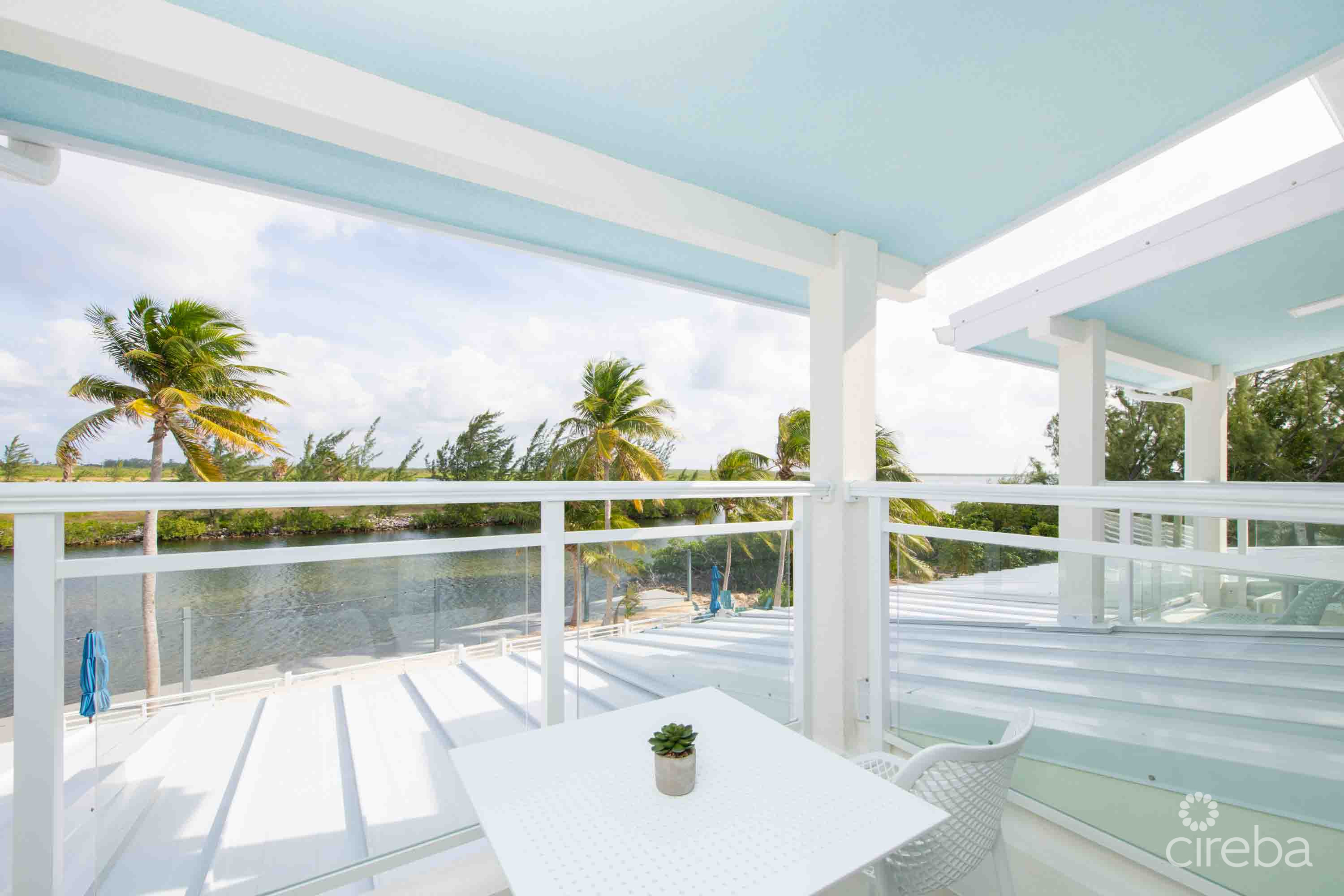CARIB SUN – EXQUISITE WATERFRONT ESTATE W /GUESTHOUSE IN CAYMAN KAI