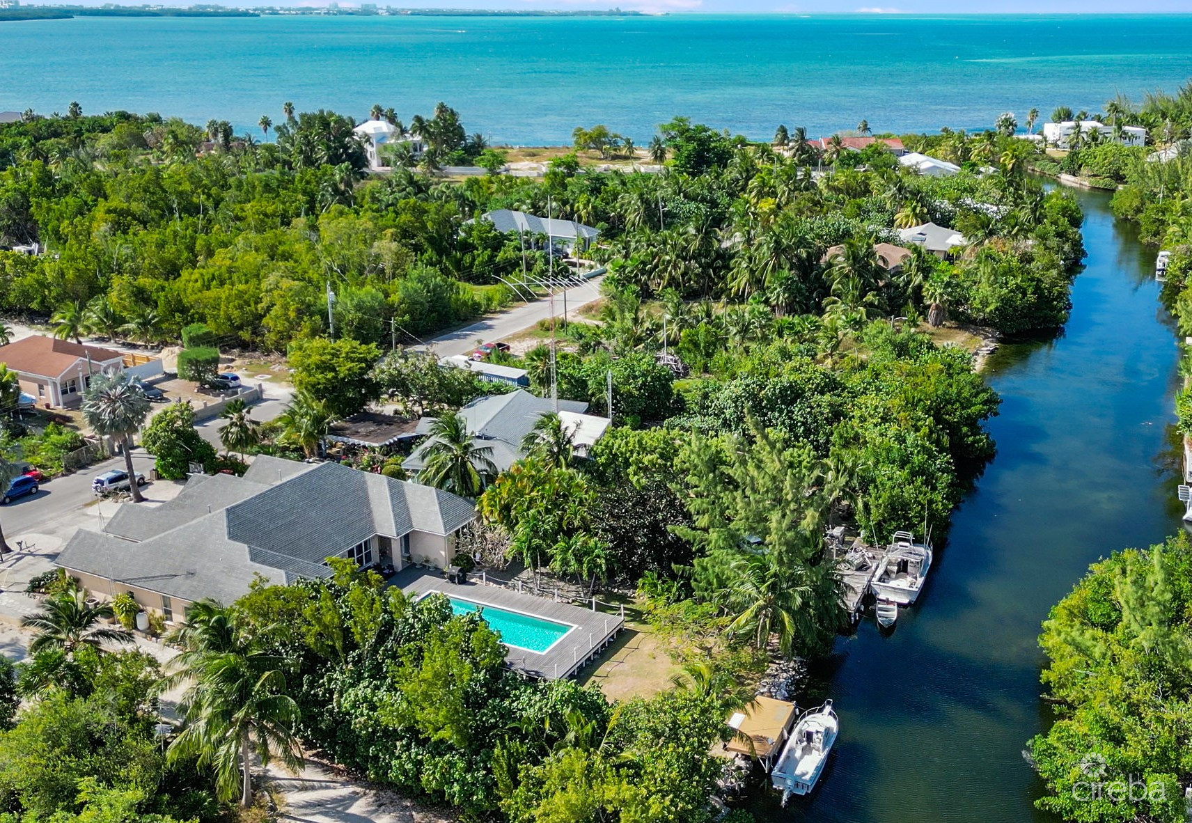 4,465 SF CANAL FRONT DUPLEX WITH POOL  (BOTH SIDES – OR INDIVIDUALLY)