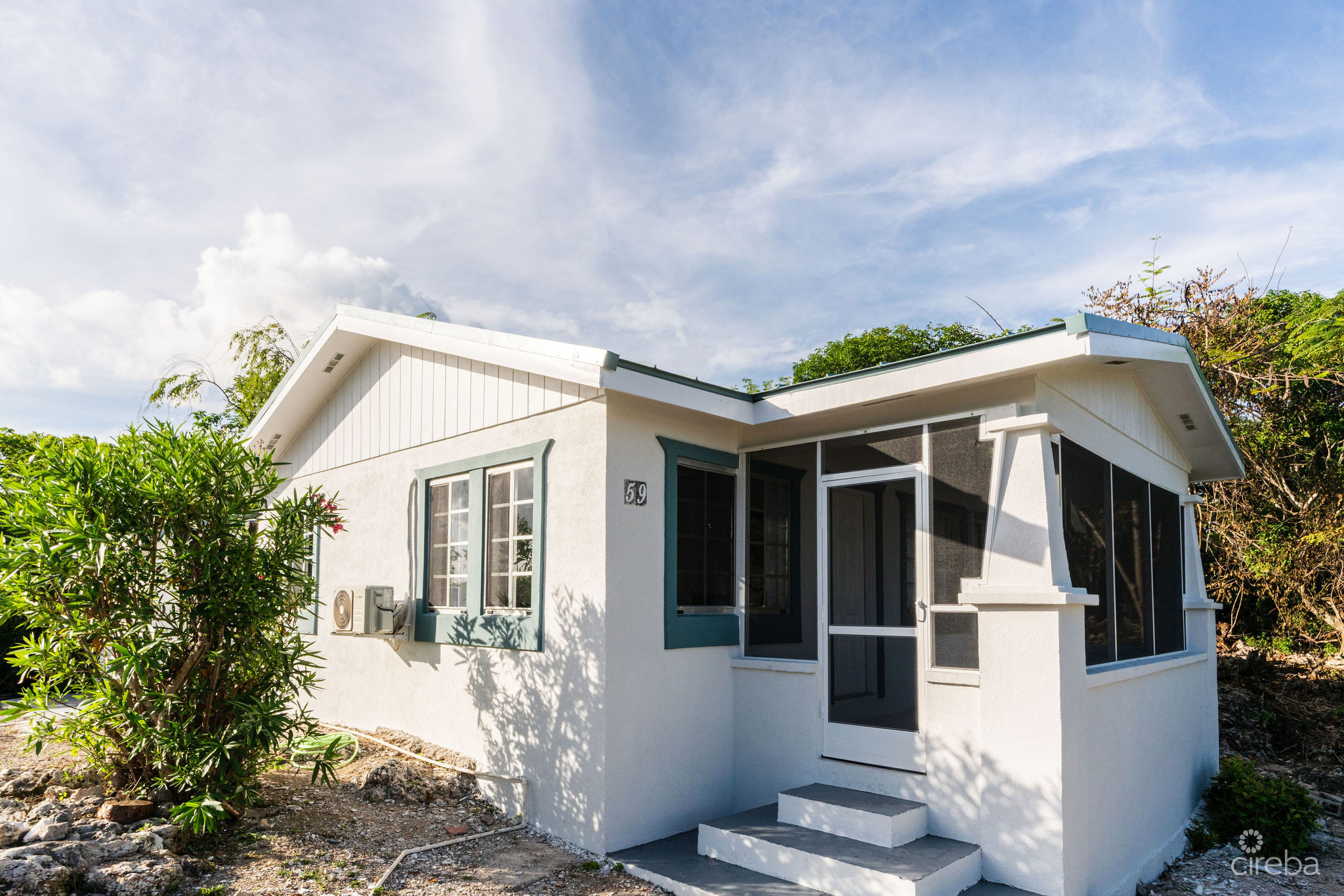 CHARMING OCEANVIEW COTTAGE ACROSS FROM THE SEA ON EXPANSIVE 0.89 ACRE LOT