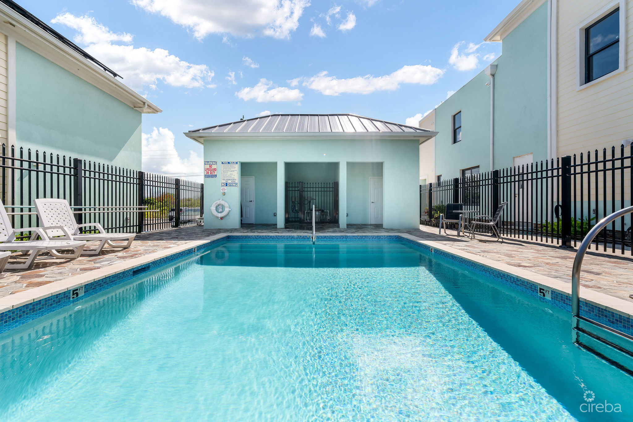 INCOME-PRODUCING RESIDENTIAL PORTFOLIO –4 STUDIOS IN WEST BAY