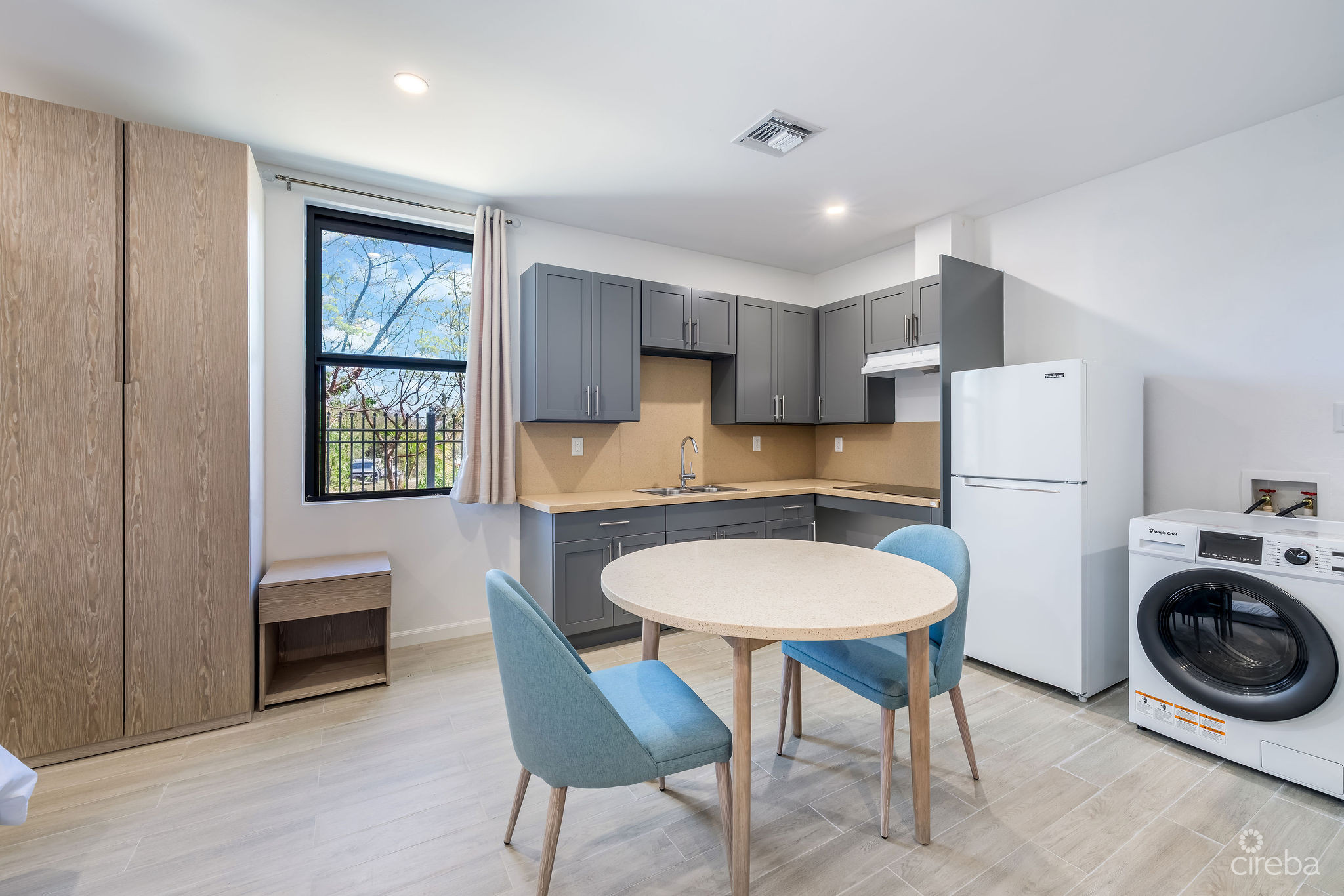 INCOME-PRODUCING RESIDENTIAL PORTFOLIO –4 STUDIOS IN WEST BAY