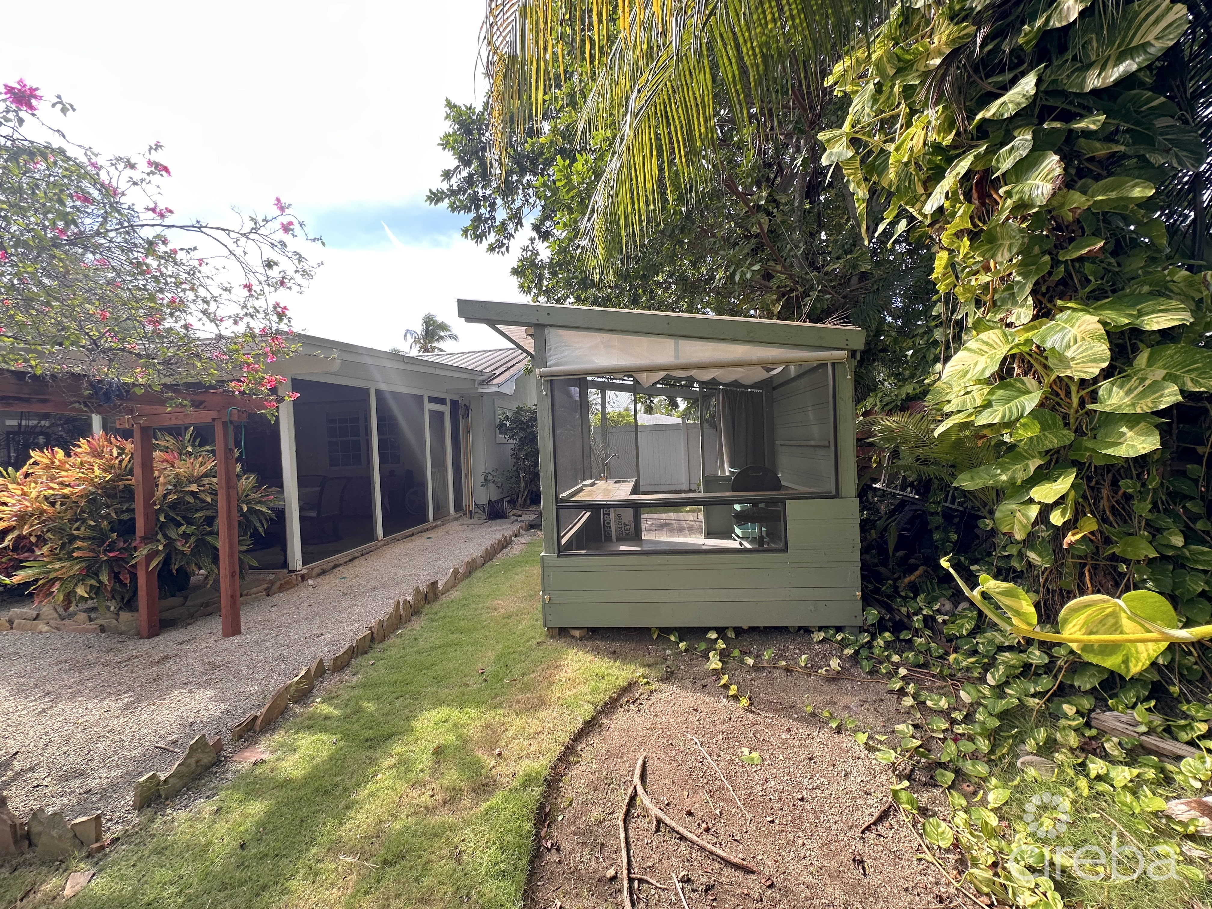 RARE DOUBLE-LOT OASIS BUNGALOW  WITH POOL IN SNUG HARBOUR