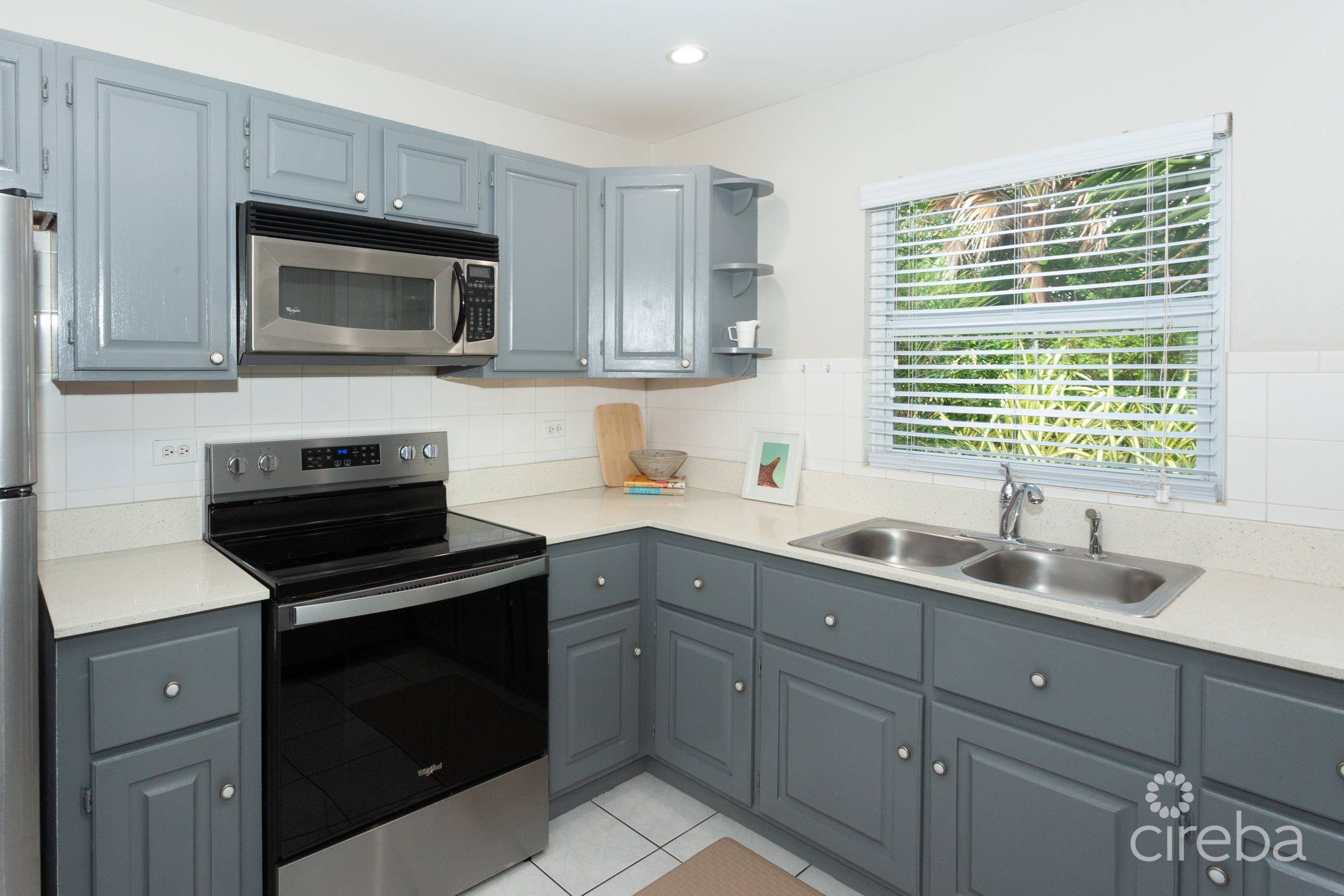 TURNKEY 2BED PLUS DEN END UNIT TROPICAL HAVEN