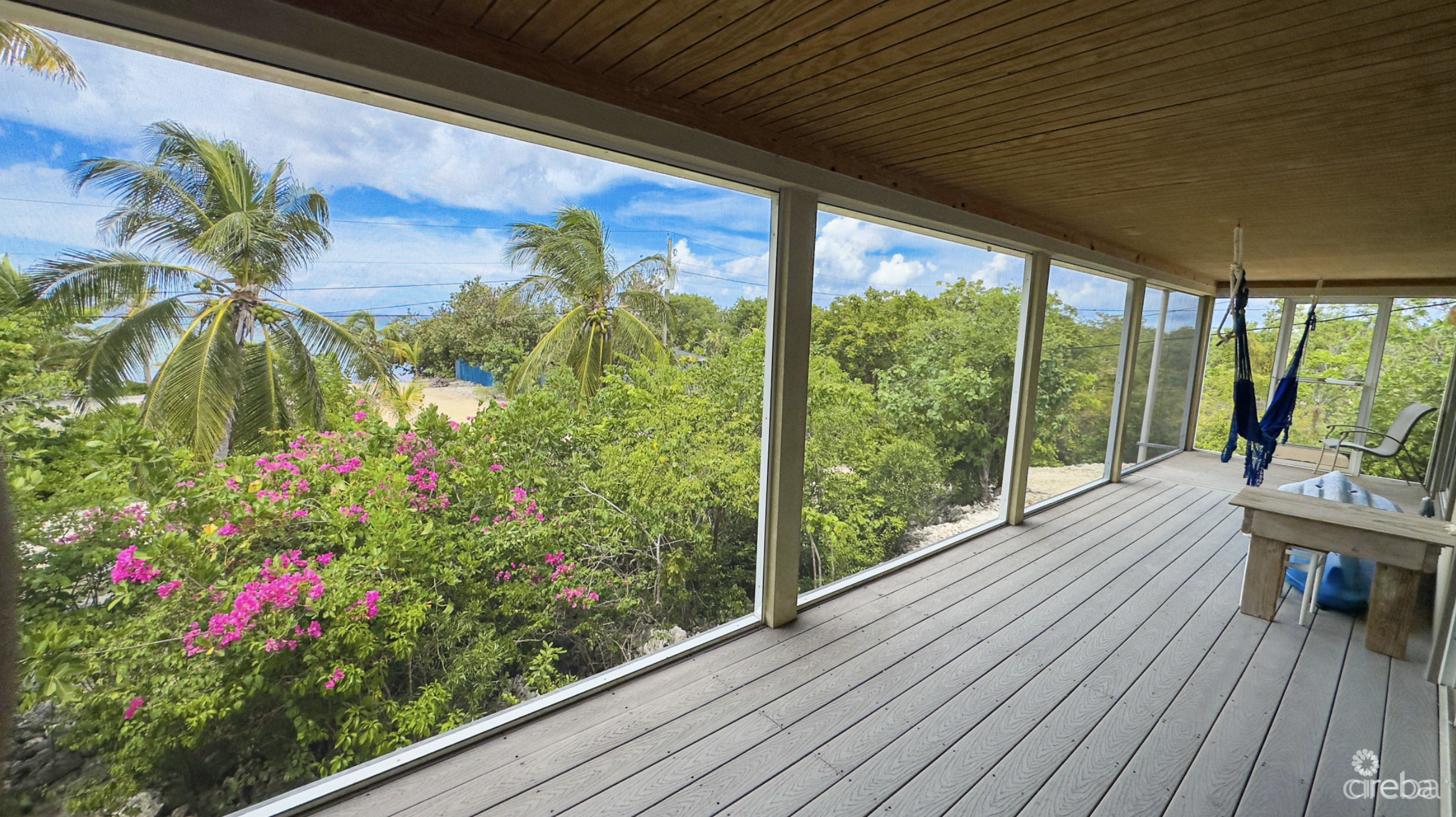 LITTLE CAYMAN OCEAN VIEW RESIDENTIAL HOME W/ BEACHFRONT LOT JUST SHY OF 1 ACRE