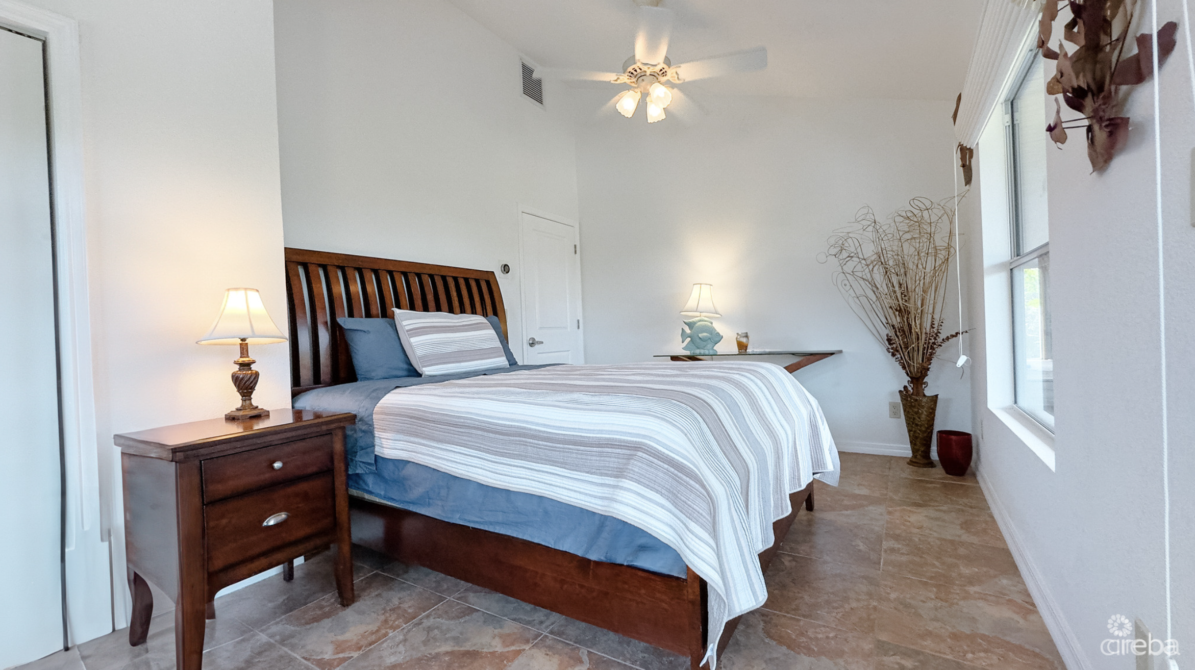 LITTLE CAYMAN OCEAN VIEW RESIDENTIAL HOME W/ BEACHFRONT LOT JUST SHY OF 1 ACRE