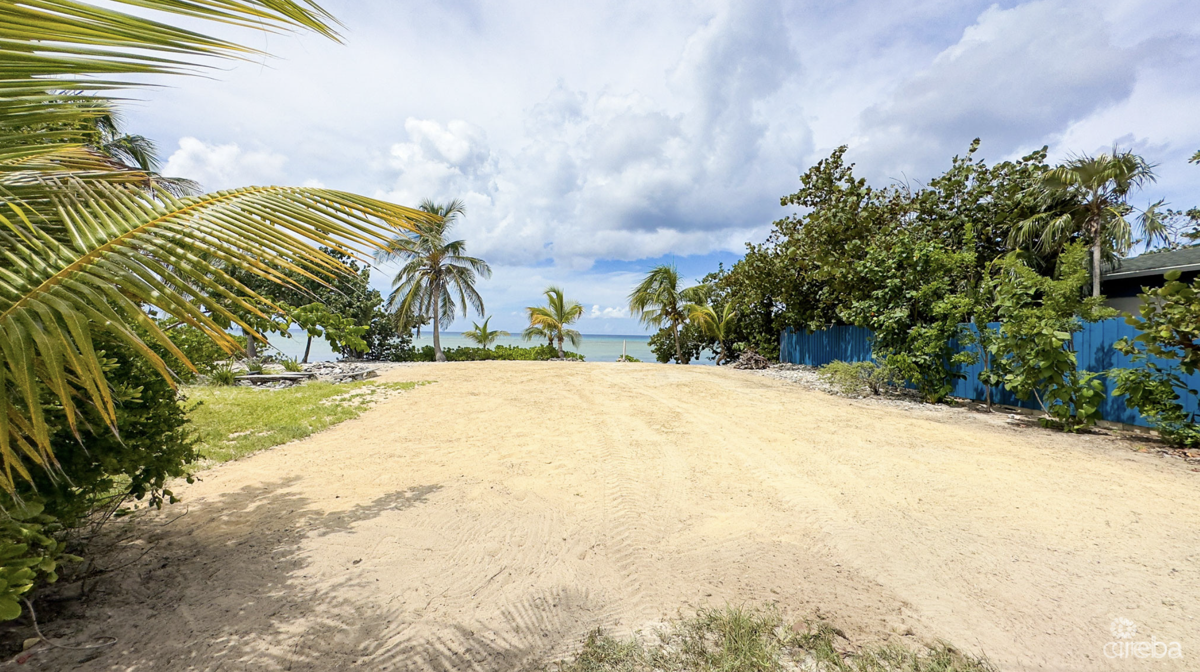 LITTLE CAYMAN OCEAN VIEW RESIDENTIAL HOME W/ BEACHFRONT LOT JUST SHY OF 1 ACRE