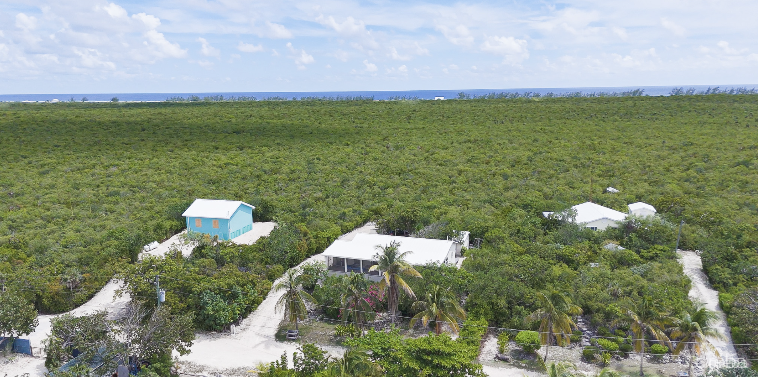 LITTLE CAYMAN OCEAN VIEW RESIDENTIAL HOME W/ BEACHFRONT LOT JUST SHY OF 1 ACRE