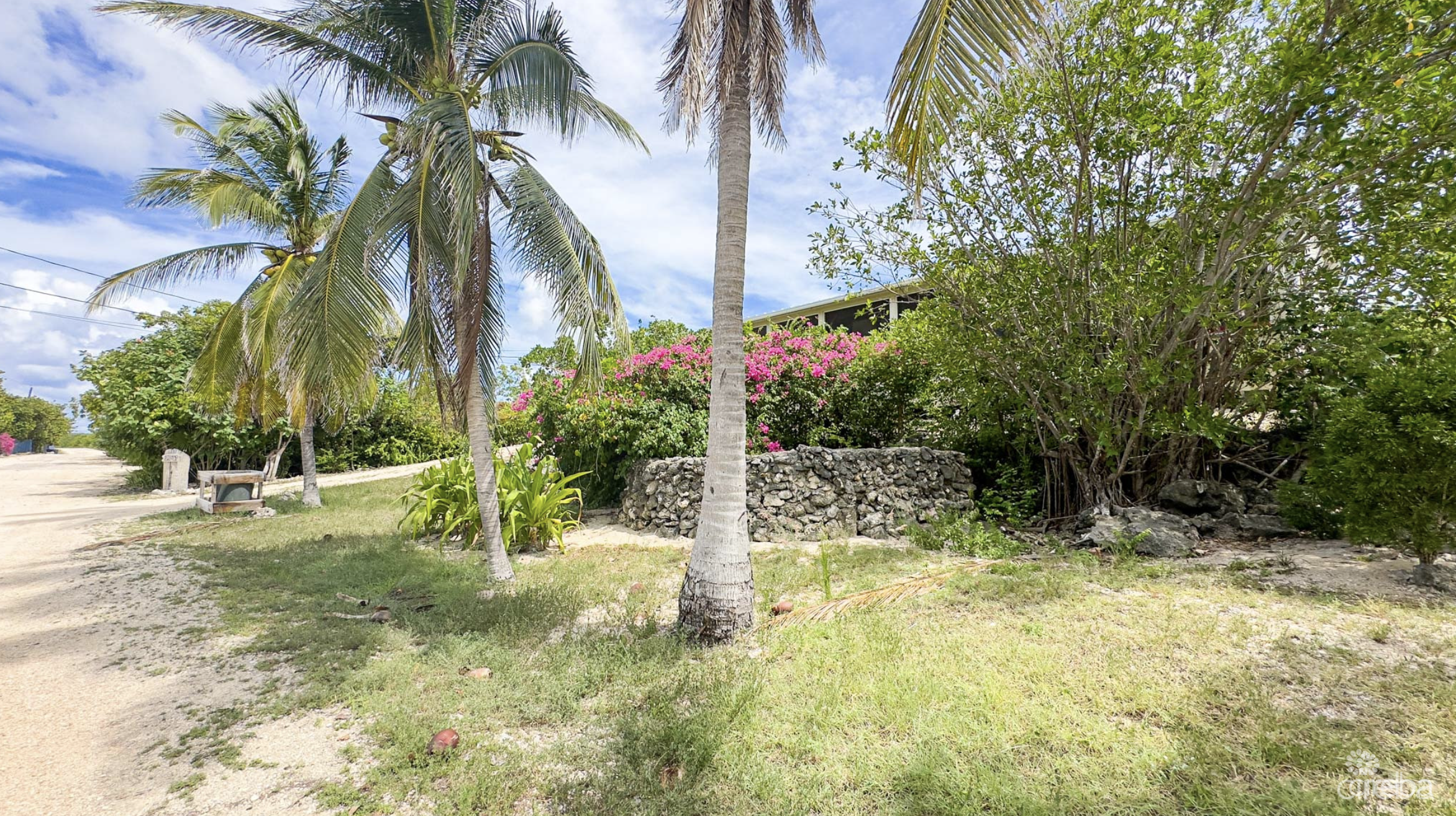 LITTLE CAYMAN OCEAN VIEW RESIDENTIAL HOME W/ BEACHFRONT LOT JUST SHY OF 1 ACRE