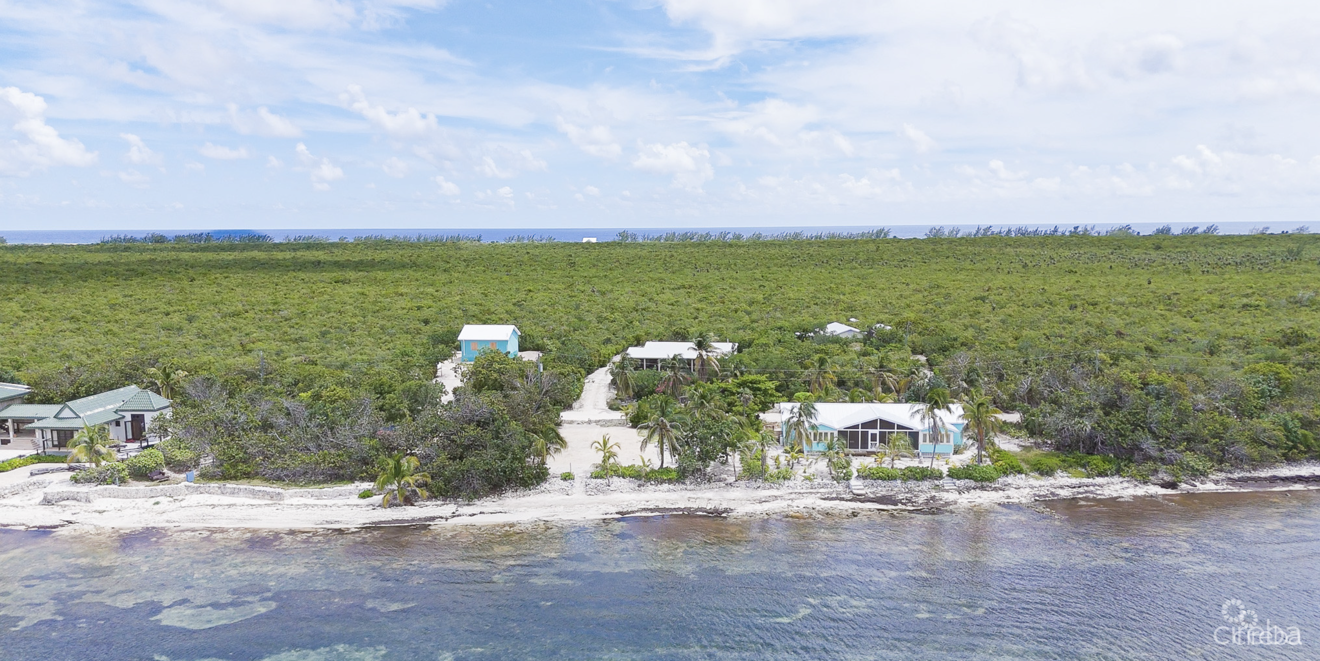 LITTLE CAYMAN OCEAN VIEW RESIDENTIAL HOME W/ BEACHFRONT LOT JUST SHY OF 1 ACRE