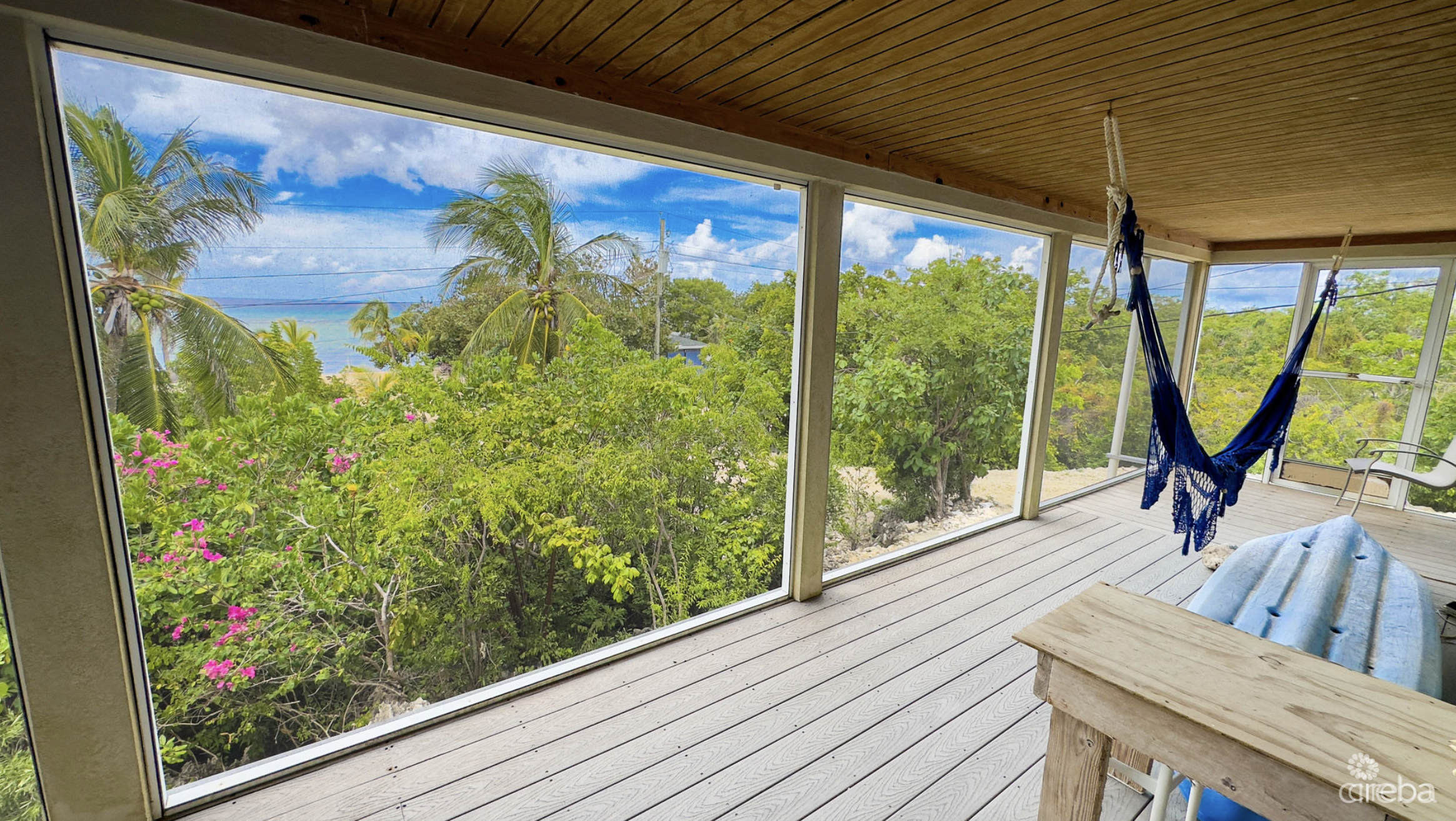 LITTLE CAYMAN OCEAN VIEW RESIDENTIAL HOME W/ BEACHFRONT LOT JUST SHY OF 1 ACRE