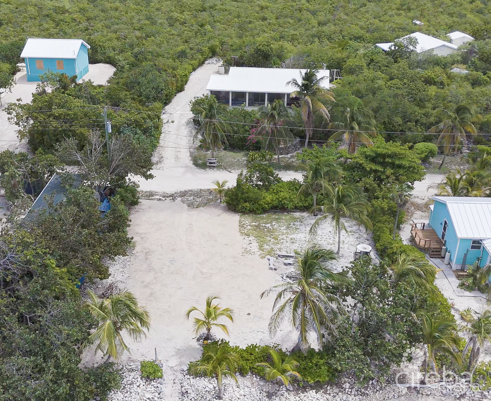 LITTLE CAYMAN OCEAN VIEW RESIDENTIAL HOME W/ BEACHFRONT LOT JUST SHY OF 1 ACRE